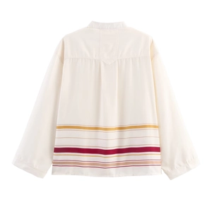 Detail of white stand-collar shirt featuring colorful striped hem and back pleated design