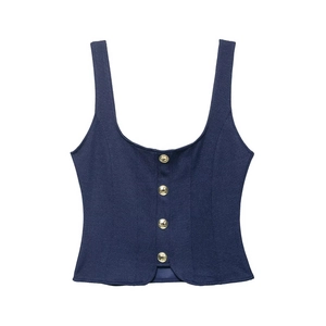 Detailed view of deep blue twill top featuring elegant gold decorative metal buttons
