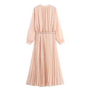Elegant peach long sleeve pleated maxi dress with matching belt for a refined look