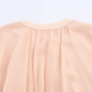 Elegant apricot chiffon pleated dress with a stylish round neckline and waist belt