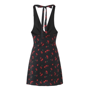 Back view of black halter neck mini dress with cherry print and bow tie open back detail