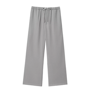 Detail of light grey casual joggers showing elastic waistband with drawstring closure