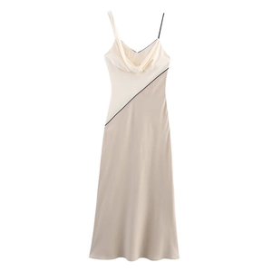 Detail of contrast stitching and asymmetrical straps on this midi satin patchwork dress