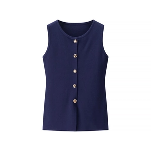 Close-up of navy knit sleeveless vest with gold metal buttons and round neckline