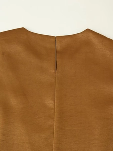 Close-up of brown satin vest back with keyhole opening and refined fabric texture