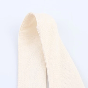 Detailed close-up of cream-white fabric strap showing fine texture and quality stitching