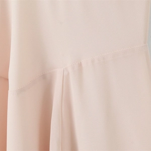 Elegant halter V-neck dress in light pink chiffon with detailed stitching and soft pleats