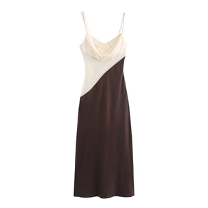 Detail of elegant two-tone slip dress with cowl neck and asymmetric shoulder straps