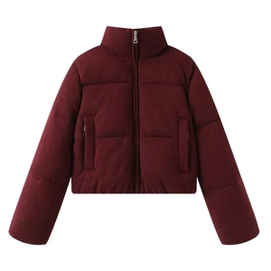 Detail view of burgundy padded jacket with knit texture fabric and high stand collar