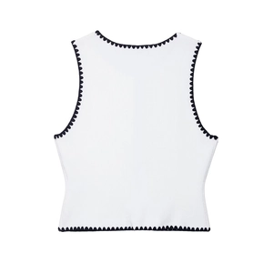 Women's sleeveless white knit crop top vest with elegant black scalloped edge details