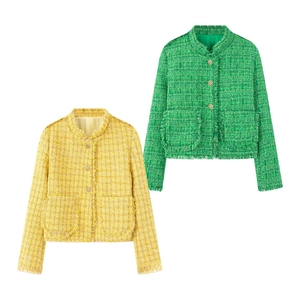 Detail of tweed jackets in green and yellow with fringe trim and golden floral buttons