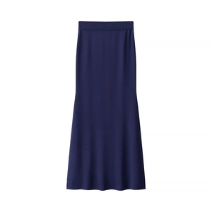Detail of navy blue high-waisted knitted skirt with elastic waist and flared hemline