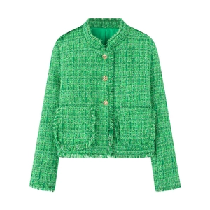 Close-up of emerald green tweed jacket with fringe edges and golden hollow buttons