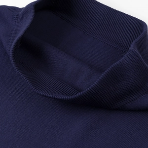 Detail view of the fine rib knit mock neck on a dark blue slim-fit women's top