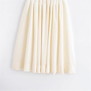 Elegant cream pleated midi skirt with vertical accordion folds and minimalist design