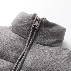Women's grey knitted jacket with stand collar and metallic zipper detail
