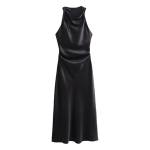 Detail of elegant black satin midi dress featuring a draped cowl neck and side pleats