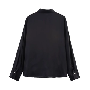 Back view of elegant black satin long sleeve shirt showing smooth texture and clean cut