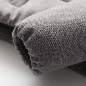 Close-up of grey ribbed knit cuffs on a stylish winter jacket with premium soft texture