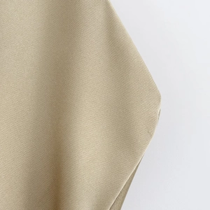 Detailed close-up of high-density khaki satin fabric with smooth twill weave texture