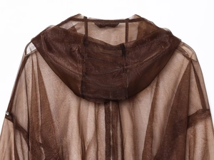 Detail of the sheer coffee brown organza hooded jacket with front zipper and trim