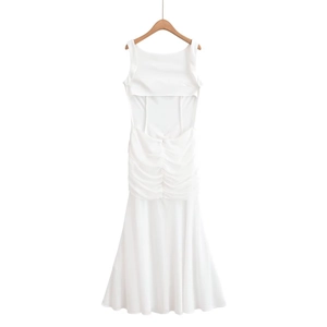 Detail of white backless sleeveless dress featuring pleated waist and fishtail hem