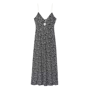 Detailed close-up of a floral V-neck dress featuring delicate lace-up bust ties and thin straps