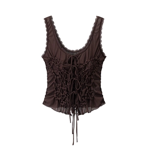 Detail of dark brown mesh top featuring delicate lace trim and ribbon bow accents