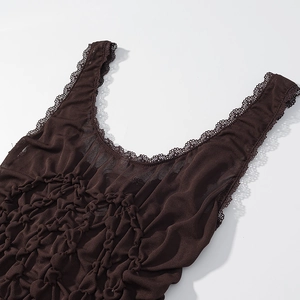 Detailed macro of coffee brown smocked tank top featuring delicate lace trim borders