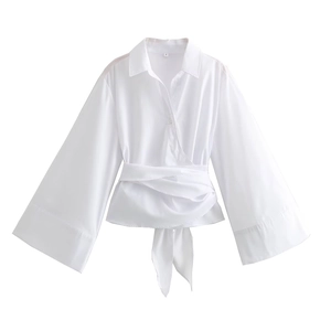 Detail of white long sleeve shirt showing flared cuffs, lapel collar, and S size label