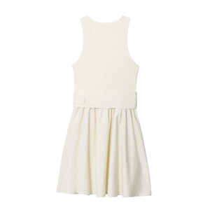 Detail of knit bodice and waist belt with buckle on cream sleeveless pleated dress