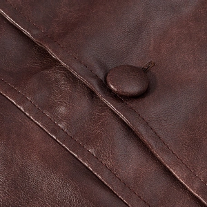 Close-up of high-quality brown PU leather jacket with button detail and fine stitching