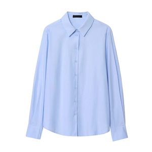 Detail of light blue button-down shirt showing standard collar and texture