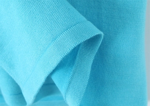 Detailed macro view of cyan blue knit fabric texture and high-quality stitching detail