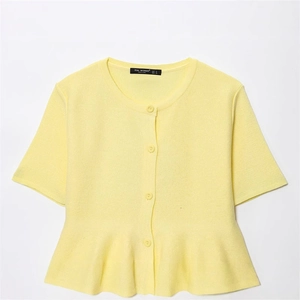 Elegant light yellow short sleeve knit cardigan with stylish peplum hem and button front