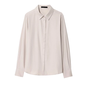 Detail of elegant light beige women's button-up shirt with classic pointed collar
