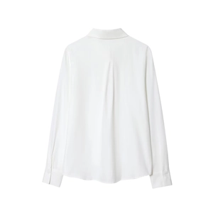 Detail view of the back pleat and premium fabric on a white long-sleeved shirt