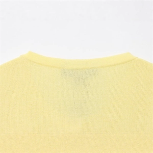 Pale yellow fine knit sweater featuring a ribbed round neckline and soft texture details