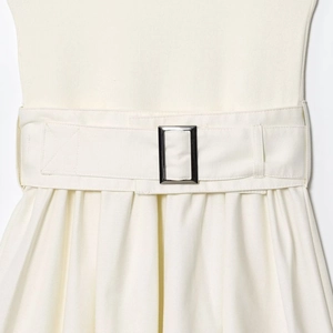 Elegant white belted dress with textured patchwork and silver buckle detail