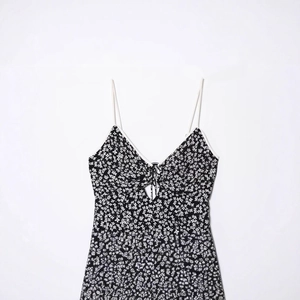 French style floral slip dress for women with V-neckline and tie-up cutout detail