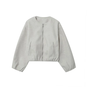 Close-up of a light grey crewneck zip-up jacket with vertical pockets and elastic cuffs