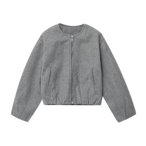 Detail of grey short zip-up jacket showing wool texture and metal zipper pockets