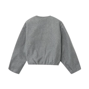 Detail view of the back of a grey round neck jacket with an elastic hem and felt texture