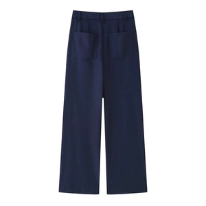 Detail view of high waist navy blue wide leg trousers with large back patch pockets