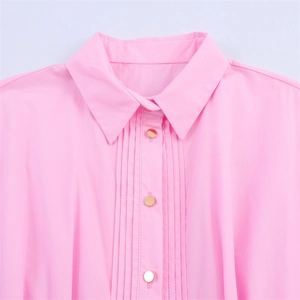 Pink poplin midi dress with sharp collar and pleated front with golden buttons