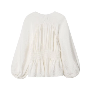 Elegant white long sleeve peplum blouse with pleated waist and textured fabric