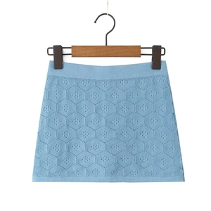 Light blue knit mini skirt featuring hexagonal honeycomb hollow patterns in an A-line style