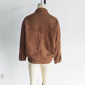 Rear view of brown suede bomber jacket showing V-shaped back seams and elastic hem