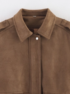 Detail of a brown suede jacket collar with epaulettes and silver metal snap button
