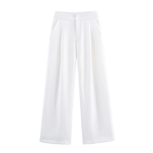 Detail of high-waisted white linen trousers featuring pleats and side pockets